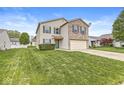 Well maintained, two-story home with manicured lawn, two-car garage and vinyl and brick facade at 8910 Youngs Creek Ln, Indianapolis, IN 46113