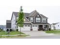 Beautiful two-story home with a three-car garage and inviting front porch at 9176 Springbrook Dr, Pendleton, IN 46064