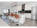 Modern kitchen with white cabinets, granite countertops, stainless steel appliances and a stylish island at 9928 Deep Royal Way, Indianapolis, IN 46239
