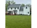 Large backyard featuring a deck and ample green space at 10118 Leeward Blvd, Indianapolis, IN 46256