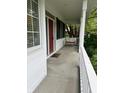 Relax on the covered porch featuring a porch swing for cozy evenings at 10118 Leeward Blvd, Indianapolis, IN 46256