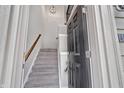 View of the entryway featuring a staircase, light fixture and a dark front door at 14226 Frostburg Dr, Carmel, IN 46033