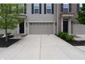 Exterior showcasing garages, driveways, and meticulous landscaping at 14226 Frostburg Dr, Carmel, IN 46033