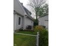 Backyard showcasing the siding, a well-kept lawn, and storage garage at 1433 Charles St, Indianapolis, IN 46225