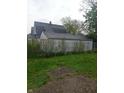 View of the backyard including a garage at 1433 Charles St, Indianapolis, IN 46225