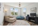 Cozy bedroom with neutral tones, a comfy chair, desk, and good natural light at 16264 Red Clover Ln, Noblesville, IN 46062