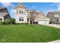 Lovely two-story home with lush green lawn and inviting curb appeal at 16264 Red Clover Ln, Noblesville, IN 46062