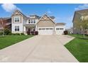 Charming two-story home with a well-maintained lawn and a wide driveway at 16264 Red Clover Ln, Noblesville, IN 46062