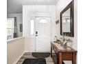 Inviting entryway featuring a console table with decor, a mirror, and stylish flooring at 1831 Whisperwood Trl, Danville, IN 46122