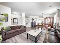 Open-concept living and dining area with stylish furnishings and plenty of natural light at 1831 Whisperwood Trl, Danville, IN 46122
