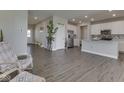 Open concept living room view showcases lots of open space with access to the kitchen at 192 Bluestem Ln, Whiteland, IN 46184