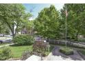 Captivating street view with lush trees and greenery, showcasing the serene neighborhood setting at 196 E Madison St, Franklin, IN 46131