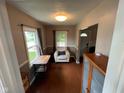 Inviting living room nook with a comfortable chair, small desk, and natural light at 209 N Lincoln St, Martinsville, IN 46151