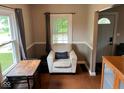 Inviting living room nook with a comfortable chair, small desk, and natural light at 209 N Lincoln St, Martinsville, IN 46151