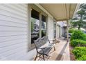 Inviting front porch with bench seating and a view of the neighborhood at 2430 Spring Hill Ct, Indianapolis, IN 46268