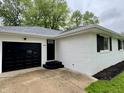 Charming single-story home featuring a one-car garage, brick exterior, and a well-manicured front lawn at 2431 Timbercrest Dr, Columbus, IN 47203
