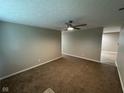 Spacious living room with neutral walls, carpet and a ceiling fan for a comfortable atmosphere at 2453 Larnie Ln, Indianapolis, IN 46219