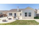 View of the home's back exterior with a patio and outdoor sitting area at 2761 Winding Creek Ln, Greenfield, IN 46140