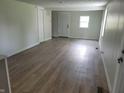 Living room with modern flooring and access to a closet at 2855 Walker Ave, Indianapolis, IN 46203