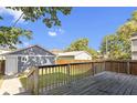 Backyard view features a wooden deck, a detached garage, and a fenced yard at 2940 N Park Ave, Indianapolis, IN 46205