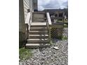 Back yard stairwell with stone and gravel yard at 3031 E 38Th St, Indianapolis, IN 46218