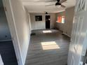 Bright living room featuring gray walls and modern flooring with ceiling fans for added comfort at 3031 E 38Th St, Indianapolis, IN 46218