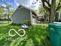 View of the house from the front yard, showing green lawn, house number, and tree at 4655 Framington Ct, Indianapolis, IN 46254