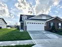 Attractive single-Gathering home with a brick facade, white garage door, and a well-manicured lawn at 6040 Bluecrest Dr, Brownsburg, IN 46234