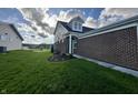 Green lawn on the side of the house, showing landscaping at 6040 Bluecrest Dr, Brownsburg, IN 46234
