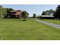 Beautiful country estate with a large lawn, charming home, and separate garage at 7140 N Michigan Rd, Fairland, IN 46126