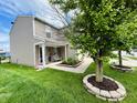 Well-kept home with tidy landscaping, a quaint porch, and attractive curb appeal at 7804 Amadeus Dr, Indianapolis, IN 46239