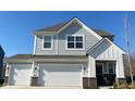 Close-up of the home's facade highlighting its architectural details and curb appeal at 9074 Larson Dr, Pendleton, IN 46064