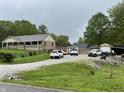 Inviting home with a long driveway and storage buildings, offering both comfort and convenience at 9510 N Cooney Rd, Mooresville, IN 46158