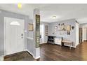 Welcoming entryway featuring stylish decor, wood floors, and a bright, airy ambiance at 9557 W Lantern Ln, Pendleton, IN 46064