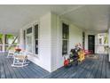 Spacious wrap-around porch with rocking chairs, perfect for relaxing and enjoying the outdoors at 1000 E King St, Franklin, IN 46131