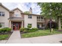 Charming condo with inviting entryway, balcony, and manicured lawn offering a cozy outdoor living space at 1046 Timber Creek Dr # 3, Carmel, IN 46032