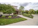 Property featuring landscaped pathway, well-maintained lawn, and inviting exterior at 1046 Timber Creek Dr # 3, Carmel, IN 46032