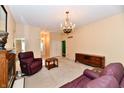 Large and bright living room featuring neutral paint, chandelier, and nice decor at 10713 Stable Dr, Indianapolis, IN 46239