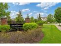 Sedona Woods neighborhood sign surrounded by lush greenery and landscaping at 11243 Catalina Dr, Fishers, IN 46038
