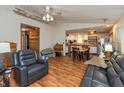 Open-concept living room showcasing hardwood floors, open access to the kitchen, and vaulted ceilings at 1157 Fielding Ln, Franklin, IN 46131