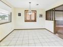 Bright dining area with tile floors and natural lighting at 1209 S Rangeline Rd, Anderson, IN 46012