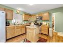 Functional kitchen featuring wooden cabinets, and stainless steel appliances and good lighting at 12256 Sagamore Woods Dr, Fishers, IN 46037