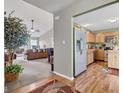 Open-concept living space showcasing a neutral color palette with a view into the kitchen and adjacent living room at 12256 Sagamore Woods Dr, Fishers, IN 46037