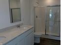 Contemporary bathroom featuring a dual sink vanity, and a shower at 1400 Bluebonnet Pl, Shelbyville, IN 46176