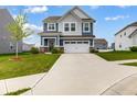Beautiful two-story home features a two-car garage, blue and gray siding, and a well-manicured lawn at 1464 Buckland Ct, Avon, IN 46123