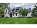 Inviting two-story home with a brick exterior, well-kept lawn, and a welcoming front entrance at 1536 Copperwood Pl, Carmel, IN 46033