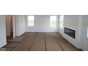 Spacious living room with fireplace, large windows for natural light, and ready for customization and decor at 1874 Victor Higgins Dr, Shelbyville, IN 46176