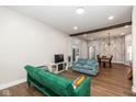 Open concept living room and dining area with a view of the kitchen at 33 N Beville Ave, Indianapolis, IN 46201