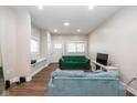 Spacious living room with hardwood floors and large windows at 33 N Beville Ave, Indianapolis, IN 46201