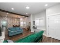 Bright living room with hardwood floors, accent wall and lots of natural light at 33 N Beville Ave, Indianapolis, IN 46201